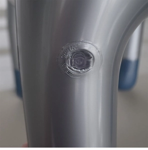 Macro detail of silver inflatable walker air valve with smooth glossy plastic texture