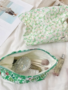 Floral canvas makeup organizer bag with secure zipper closure for cosmetics and skincare