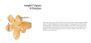 Macro detail of alloy flower ring showing matt gold finish and 2.8cm outer diameter