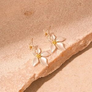 Minimalist flower stud earrings in matte silver and gold plating on stone