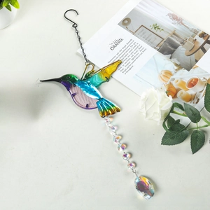 Detail of hummingbird suncatcher with crystal prism pendant for garden decoration