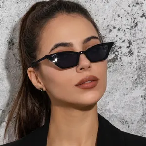 Chic retro small cat eye sunglasses with narrow black frame for women's street style
