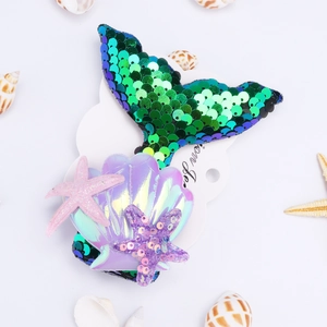 Detailed set of mermaid tail hair clips with shiny sequins and shell on white display card