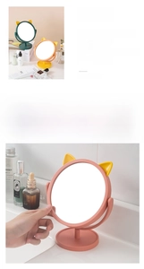 Detail view of the 360 degree adjustable rotating cat ear desktop makeup vanity mirror