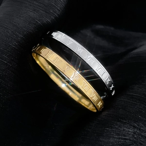 Luxury gold and silver titanium steel bracelets with Roman numeral engravings on black silk
