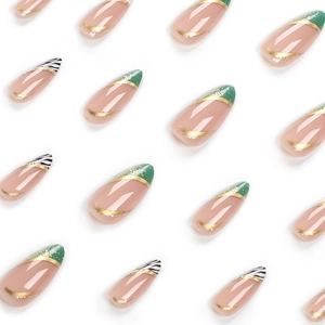 Almond fake nails with green french tips, gold lines, and zebra patterns on white background