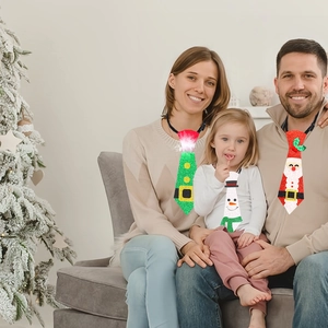 Three Christmas ties featuring Santa and Snowman themes with LED lights for holiday parties