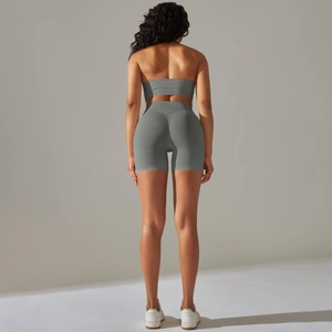 Rear view of seamless rib-knit high waist fitness shorts and matching sports bra set