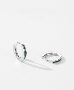 Detail of S925 sterling silver hoop earrings with rectangular green zircon inlay