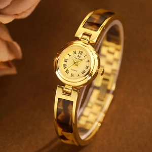 French vintage tortoiseshell gold bangle watch for women featuring amber texture accents
