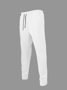 Dettaglio dei pantaloni jogger bianchi con trama diagonale, vita con coulisse e polsini a coste