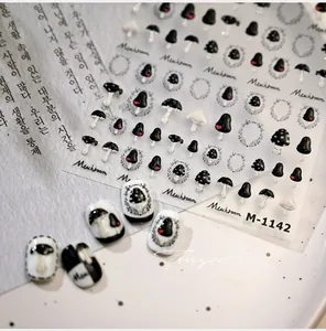 Detail view of M-1142 mushroom nail stickers with hand-drawn black and white art