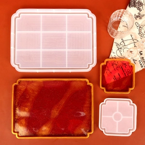 Detail of vintage tray silicone molds with red and gold glitter epoxy resin finish