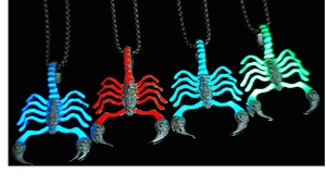 Luminous scorpion pendants glowing in blue, red, cyan, and green on metal chains