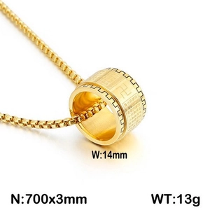 Macro shot of gold stainless steel spinning pendant with engraved Buddhist scripture