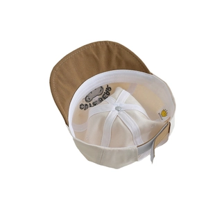 Inside view of baby cotton baseball cap with adjustable strap and bear embroidery