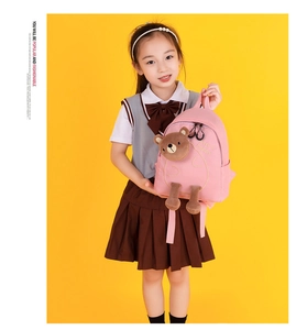 Pink preschool backpack detail with cute 3D brown bear and embroidered happy text
