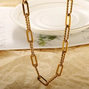 Detail showing gold-plated stainless steel twist and paperclip chain link textures