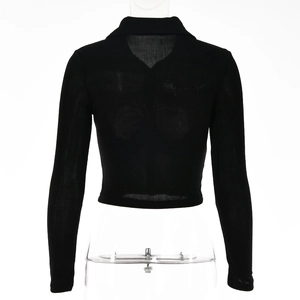 Back view of a black long-sleeve cropped top with a lapel collar and single-breasted design