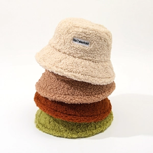 Winter faux lamb wool bucket hats for women in four stacked colors with letter patch