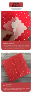 Detail of red scalloped napkins showing durable wet strength and gold foil dot printing
