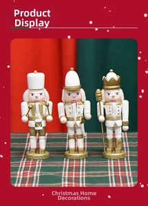Three-piece gold and white nutcracker soldier set holding drum, sword, and scepter