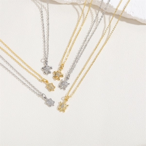 Minimalist turtle pendant necklace in gold and silver finish with zircon stones