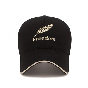 Black mesh baseball cap featuring gold feather embroidery and Freedom text on front