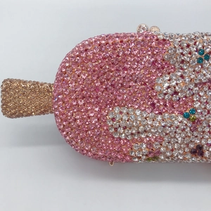 Close-up of pink and gold crystals on a popsicle-shaped evening clutch bag