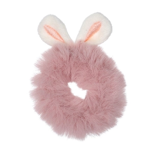 Detailed close-up of a pink faux rabbit fur scrunchie with cute bunny ears on white background