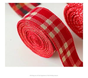 Macro view of red and beige plaid Christmas ribbon with stitched edges for gift wrapping