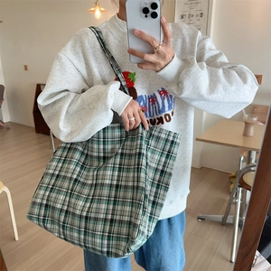 Green and white checkered canvas tote bag shown in a stylish mirror selfie for daily use