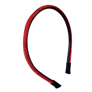 Detail view of the red rhinestones inlay and the comfortable black fabric ends on headband