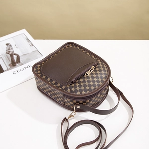 Vintage brown crossbody bag with geometric print and front zipper pocket detail