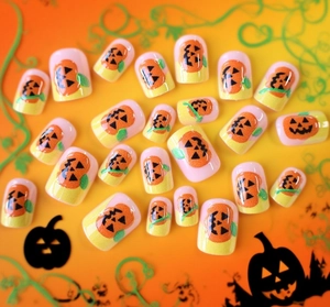 Halloween pumpkin theme press-on nails with orange jack-o'-lantern patterns and color blocking
