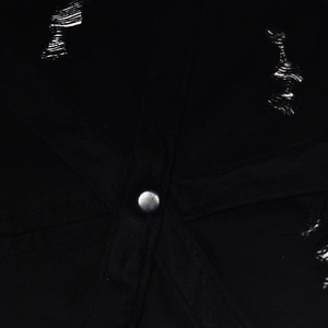 Macro detail of distressed vintage baseball cap top with metal rivet and frayed stitching