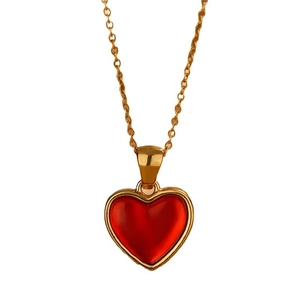 Minimalist gold stainless steel necklace featuring a vibrant red heart resin pendant