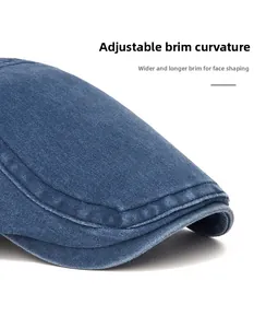 Detail of blue denim cap featuring a foldable wide brim for face contouring effects
