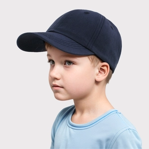 Close-up of navy blue cotton baseball cap for kids with six-panel structure and vent holes