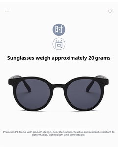 Detail view of lightweight 20g black PC frame sunglasses with streamlined design
