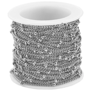 Close-up of stainless steel bead satellite chain on a spool for DIY jewelry
