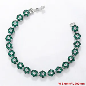 Detail view of flower-shaped tennis bracelet with green crystals measuring 8.0mm in width