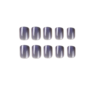 Short round rectangle press-on nails with deep purple cat-eye magnetic glitter effect