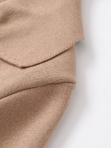 Detail of camel short sleeve knit cardigan showing collar stitching and fabric texture