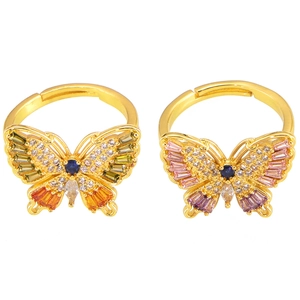 Elegant gold open butterfly rings set with colorful zircon stones on white background