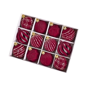 Set of 12 burgundy velvet Christmas ball ornaments with gold glitter details in a box