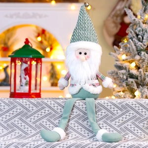 Close-up of a festive Christmas gnome with a green knit hat and long legs for holiday decor