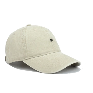 Detail shot of R letter embroidery on washed beige cotton baseball cap with curved brim