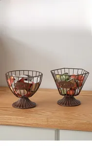 Detail of round and hexagonal wire coffee pod baskets with stamped COFFEE metal plate