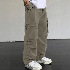Men's loose fit olive green parachute cargo pants with functional multi-pocket design